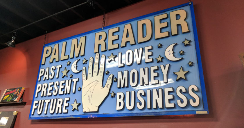 Palm Reader sign in the Hereafter Hauntings exhibit at The Mystic Museum