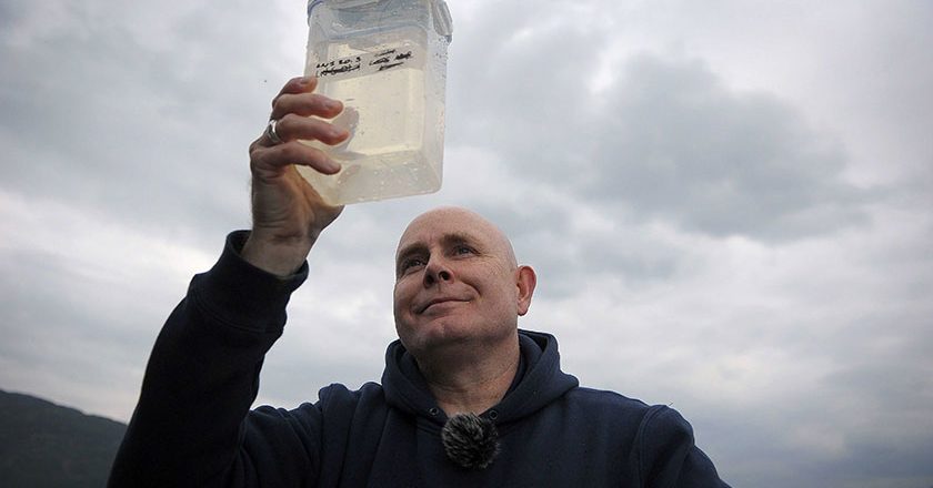 Dr. Neil Gemmell of University of Otago in New Zealand collects eDNA samples from the waters of Loch Ness