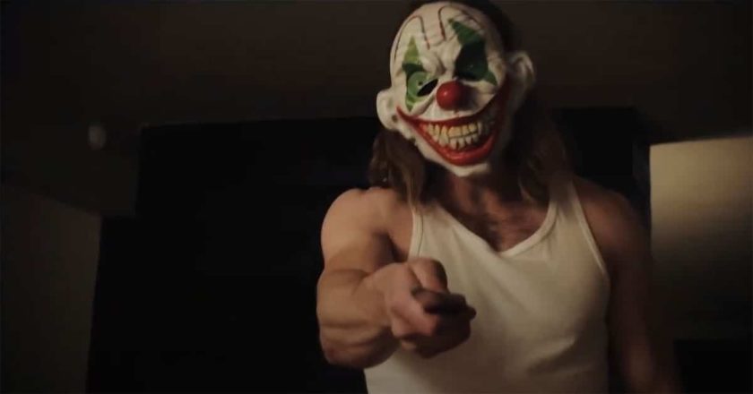 Killer wielding a knife in a clown mask