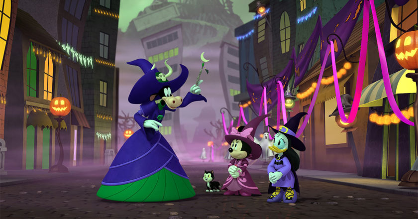 Clarabelle Cow, Minnie Mouse, and Daisy Duck dressed as witches