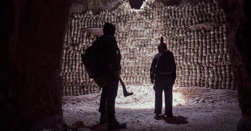 Scene from Firebite inside of a cave full of skulls