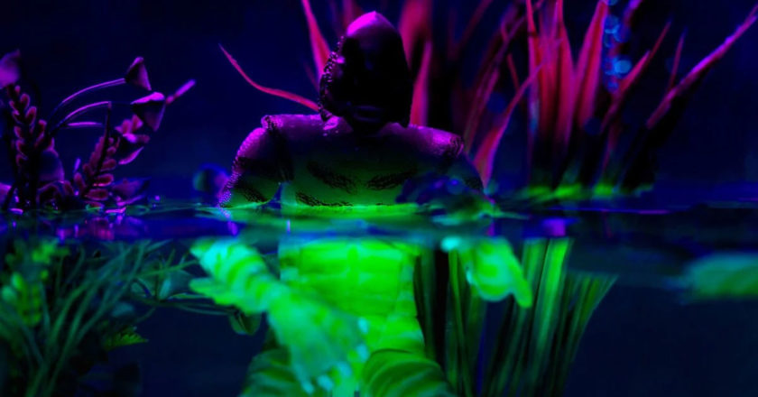 Glow-in-the-dark Creature from the Black Lagoon figure in water