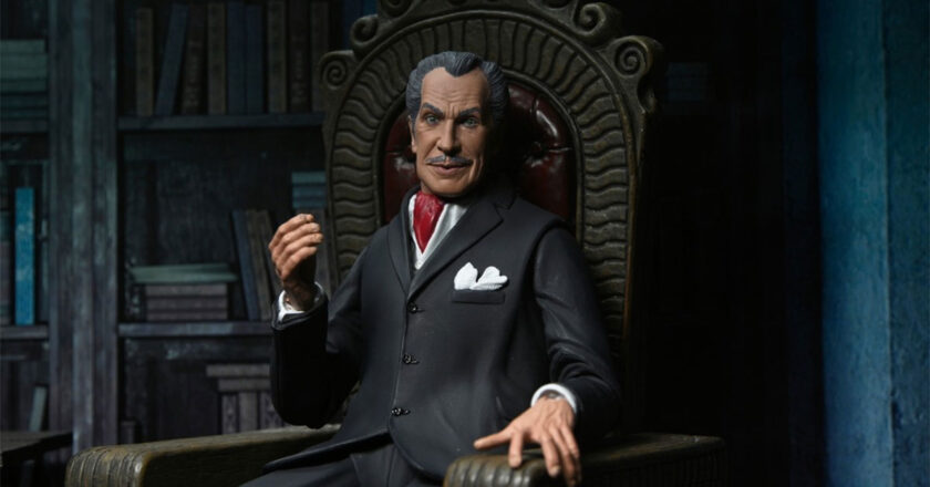 NECA's Ultimate Vincent Price figure sitting in a large wooden chair