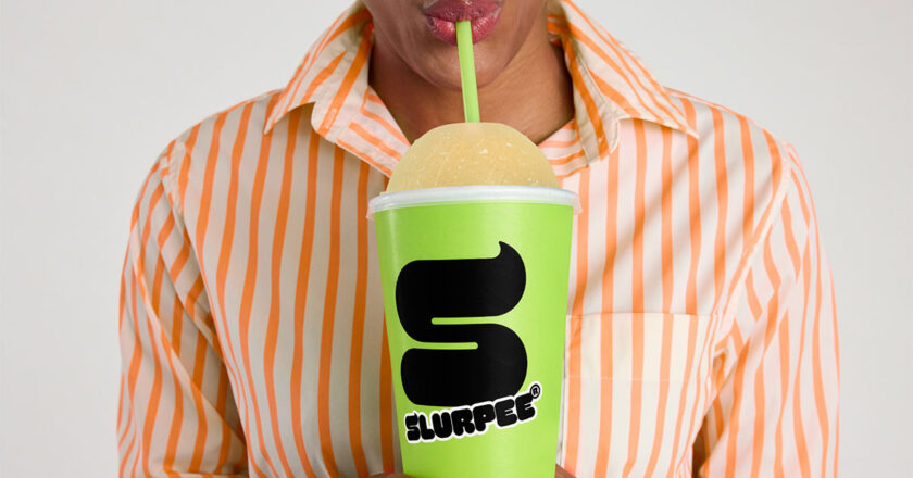 Woman drinking a Pumpkin Spice Slurpee