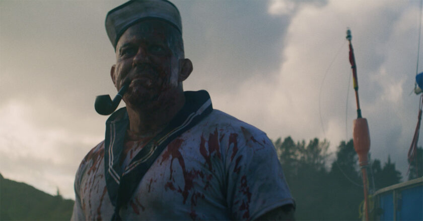 Popeye smokes a pipe while covered in blood in Popeye's Revenge