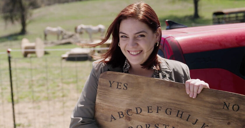 Emily Classen holds a large wooden Ouija board in For Sale By Exorcist